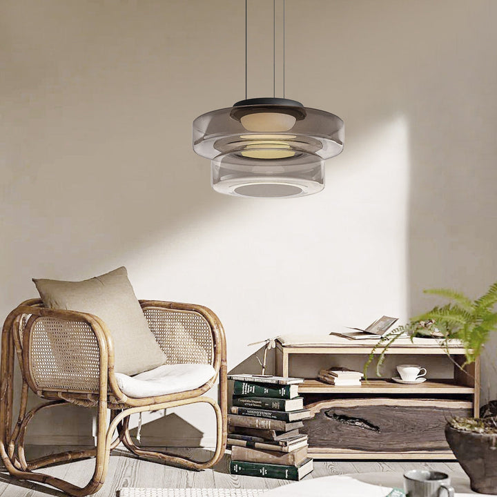 Bauhaus style glass pendant light. Modern adjustable lamp for versatile home illumination.