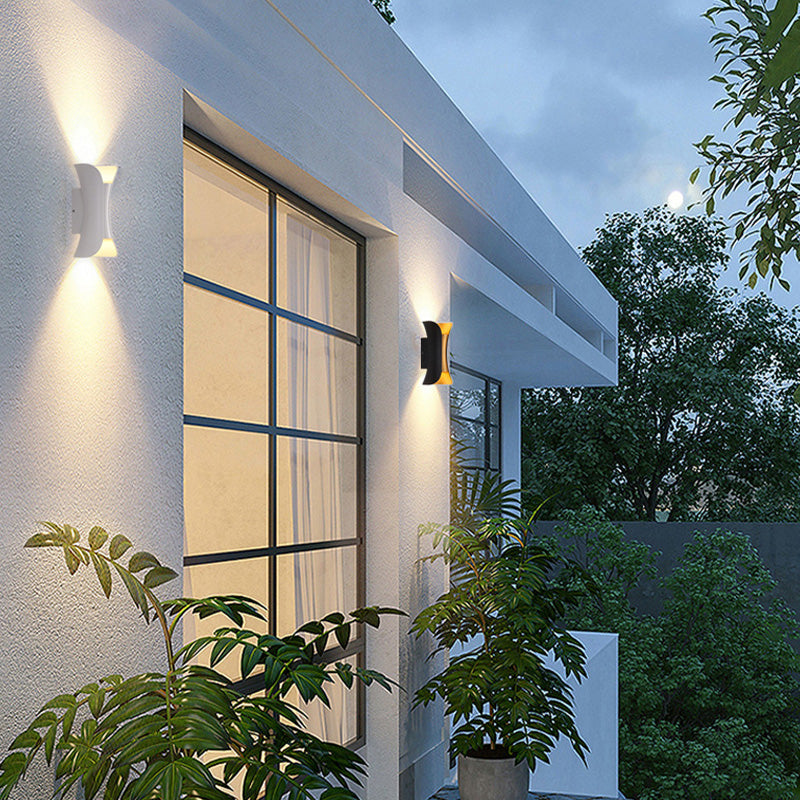 Modern black outdoor LED patio lamp, adjustable light for garden ambiance.
