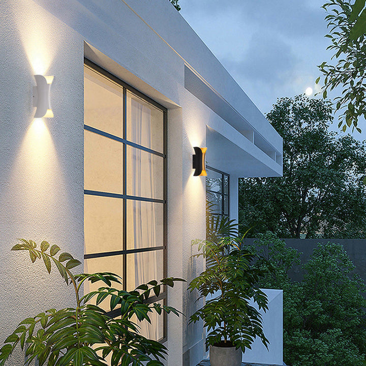 Modern black outdoor LED patio lamp, adjustable light for garden ambiance.