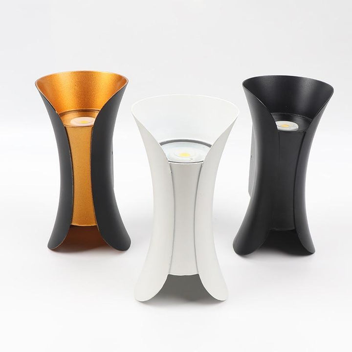 Architectural black LED outdoor wall sconce, energy-efficient for contemporary spaces.