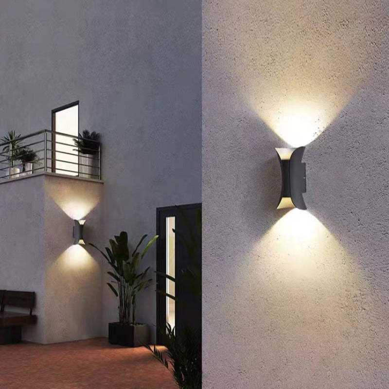 Sleek white LED wall sconce, ideal for modern exterior home & garden lighting.