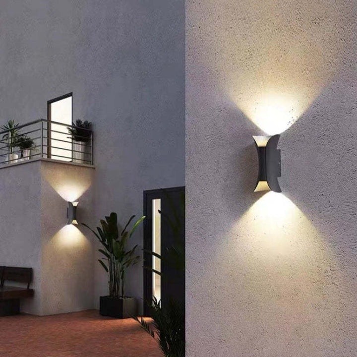 Sleek white LED wall sconce, ideal for modern exterior home & garden lighting.