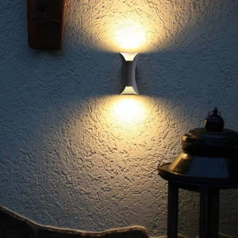 Elegant gold outdoor LED lamp, perfect for architectural garden & patio illumination.