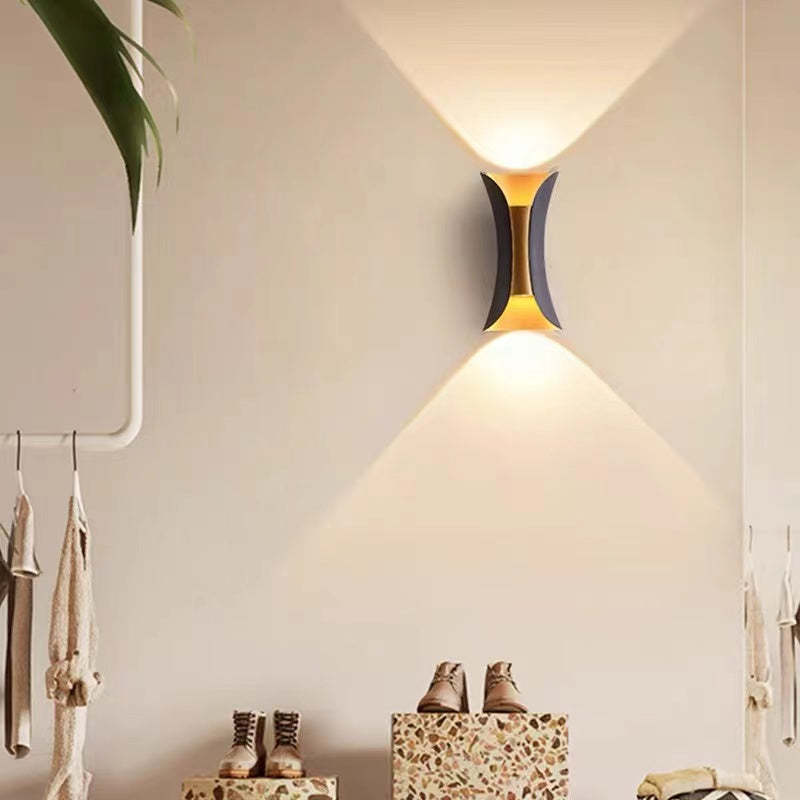 Gold LED architectural wall sconce, outdoor, energy-saving, for stylish patios.