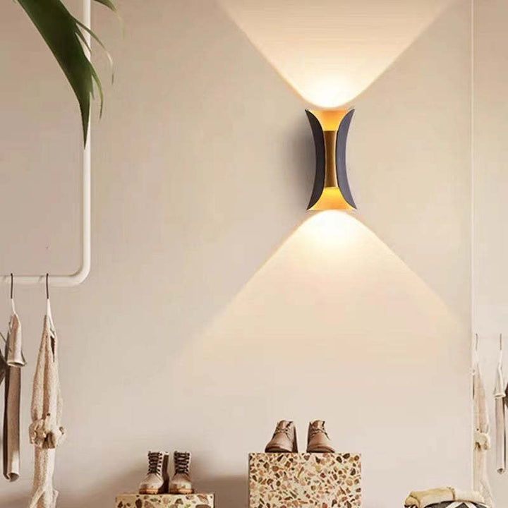 Gold LED architectural wall sconce, outdoor, energy-saving, for stylish patios.