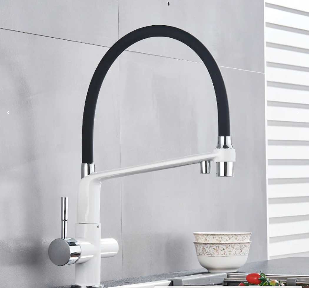 Contemporary brass kitchen tap, PureFlow Duo, providing filtered water from its double outlet design.