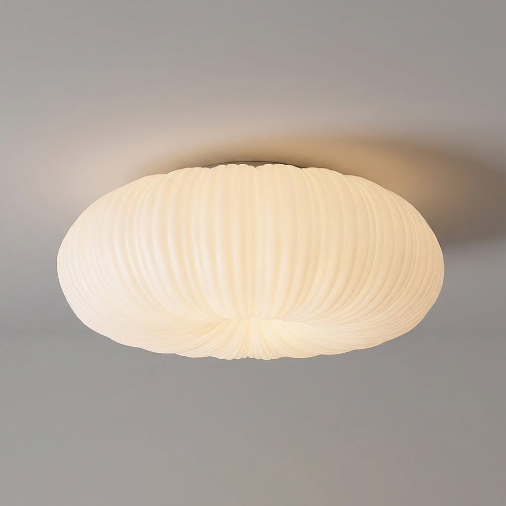 Contemporary flush mount ceiling light, ideal for modern interior design, with a soft ambient glow.