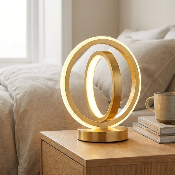 Modern circular accent table lamp, AuraLoop, illuminating a contemporary living space