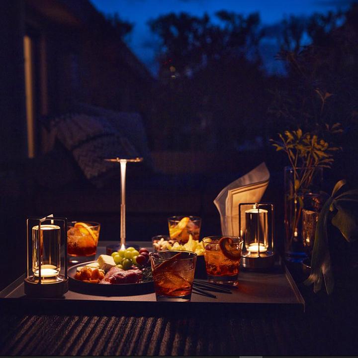 Indoor outdoor modern table lamp, portable, dimmable LED for any space.