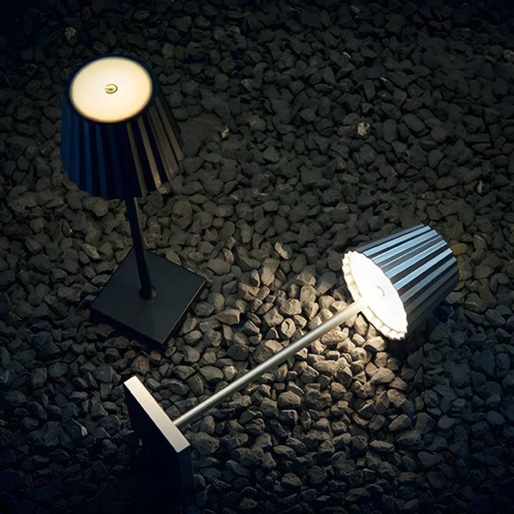 Sleek aluminum dimmable LED table lamp, modern cordless design for indoor & outdoor ambient lighting.