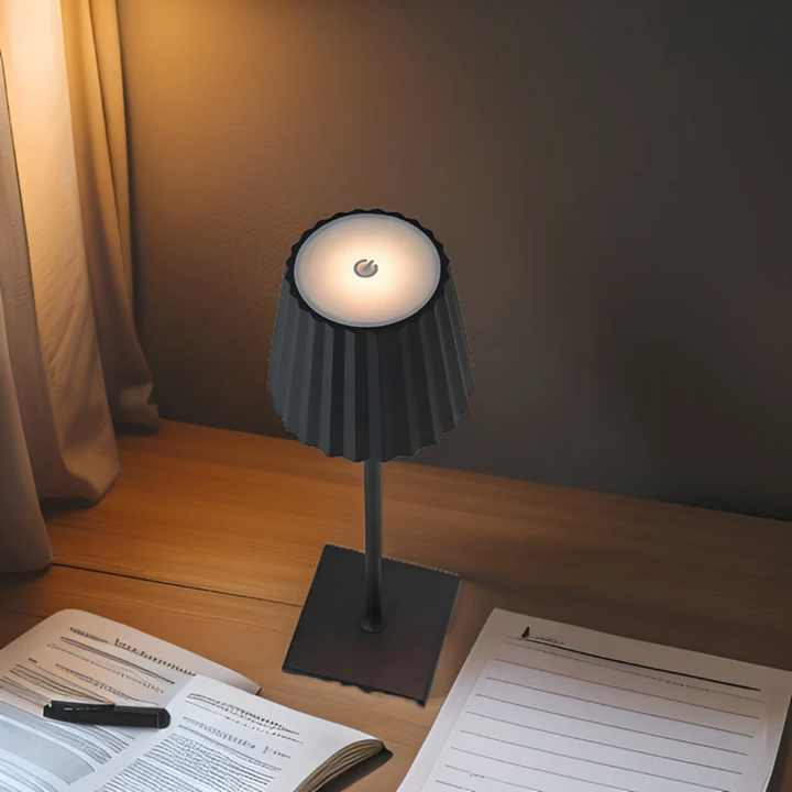 Rechargeable cordless LED table lamp, portable with touch dimming control, elegant aluminum finish.