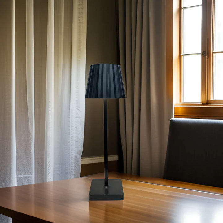 Ambient modern LED table lamp, cordless & dimmable with touch control, elegant aluminum design.