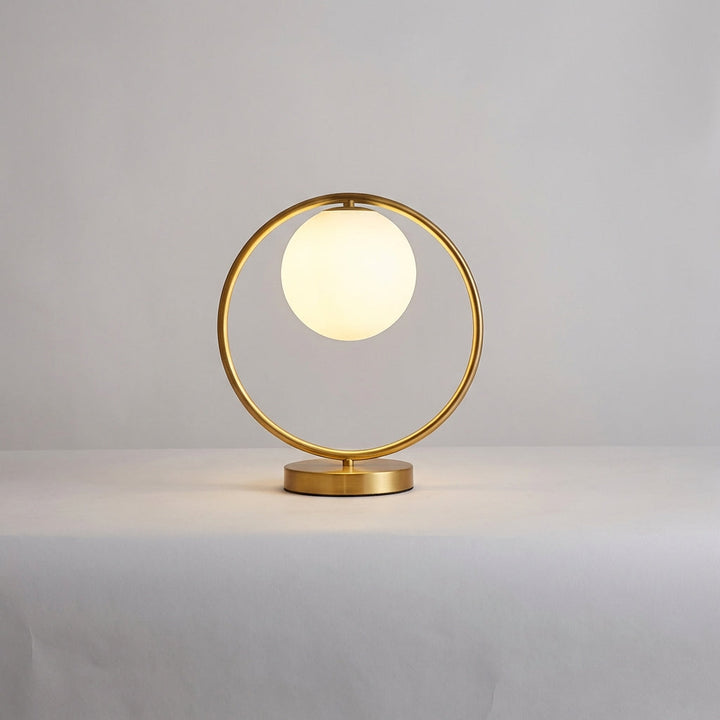 Desktop LED ring lamp, Orbella, with dimmable feature, providing stylish and functional accent lighting.