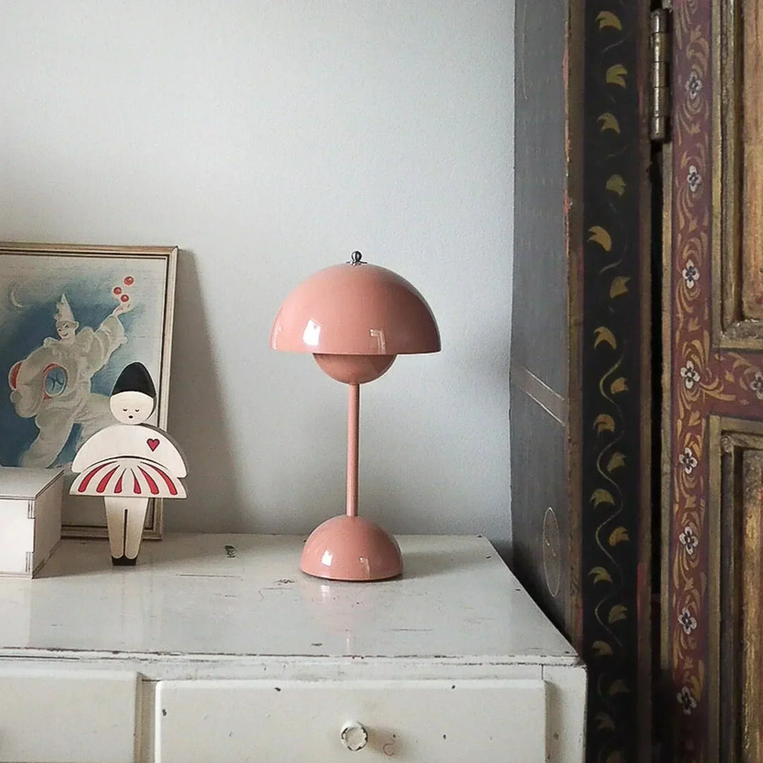 Stylish rechargeable LED table lamp. Dimmable for bedroom, living room, or desk; modern home decor accent.