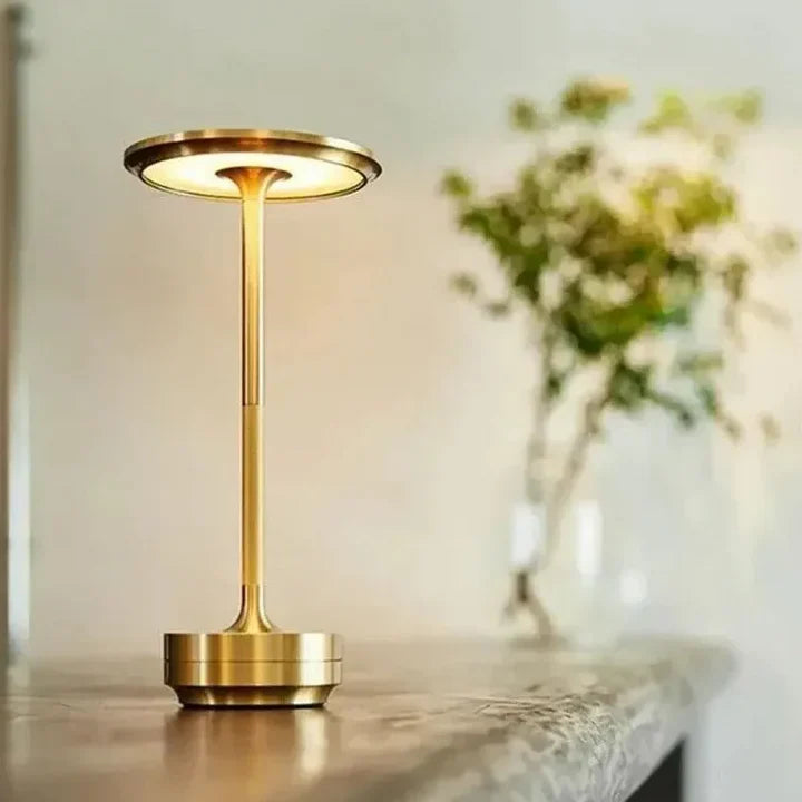 Sleek wireless table light, dimmable and waterproof, ideal for indoor or outdoor ambience.
