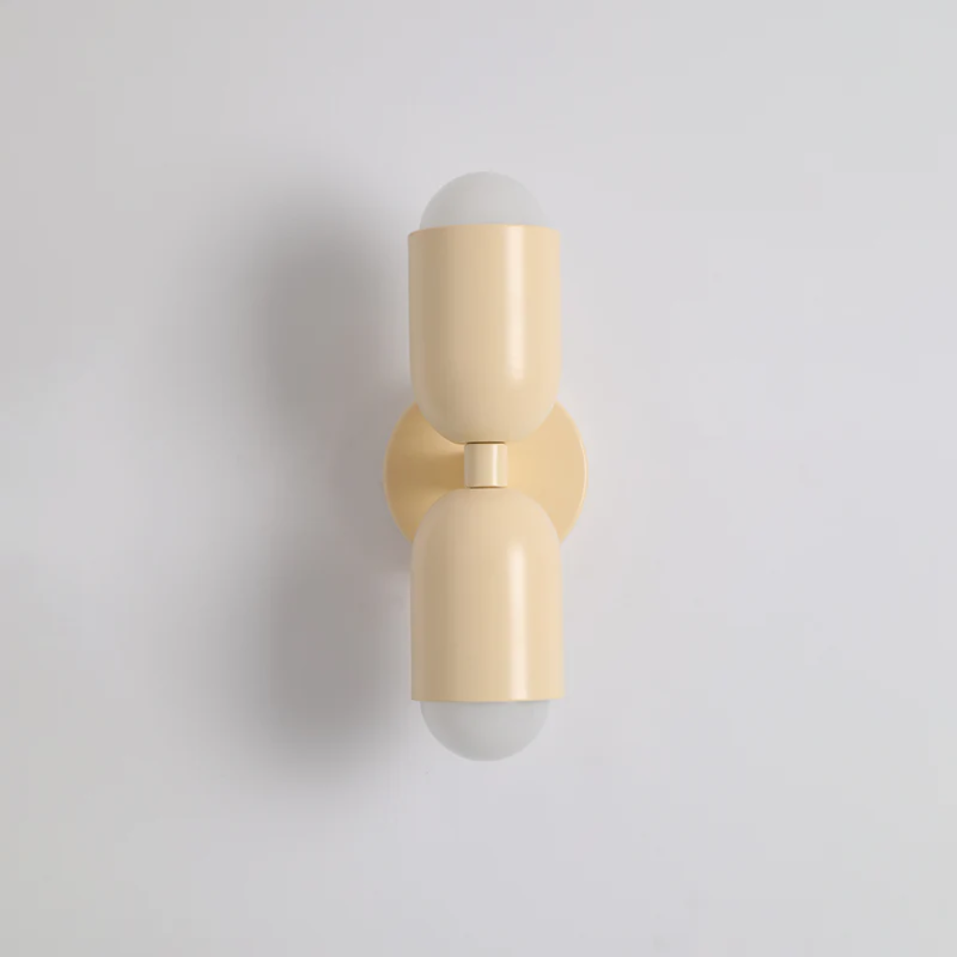 Modern double-sided LED wall lamp, black metal, casting vibrant up/down light. Perfect for contemporary home decor.