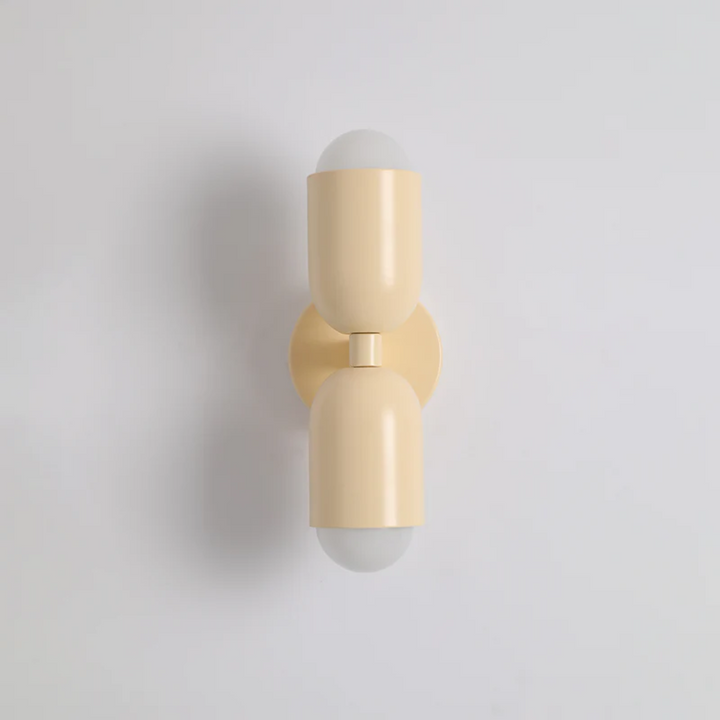 Modern double-sided LED wall lamp, black metal, casting vibrant up/down light. Perfect for contemporary home decor.