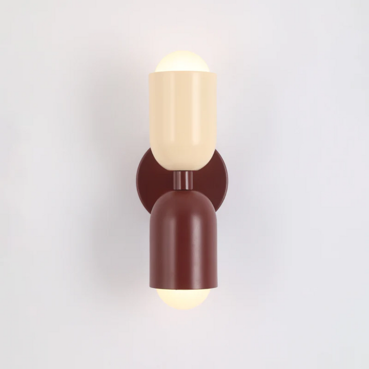 Contemporary metal wall lamp with double-sided LEDs, enhancing modern interior design and vibrant ambiance.