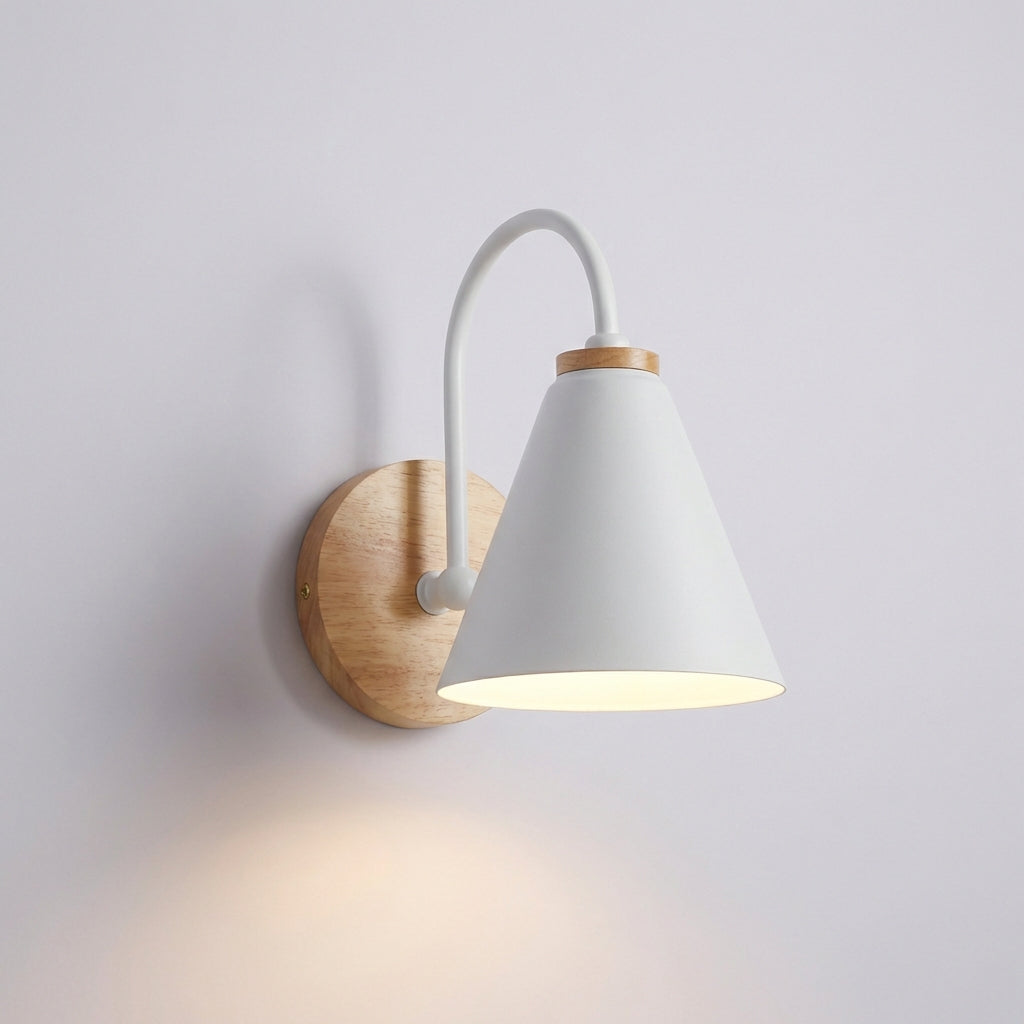 Minimalist AureliaLamp wall sconce with a unique cone shade, enhancing a contemporary interior with its modern lighting.