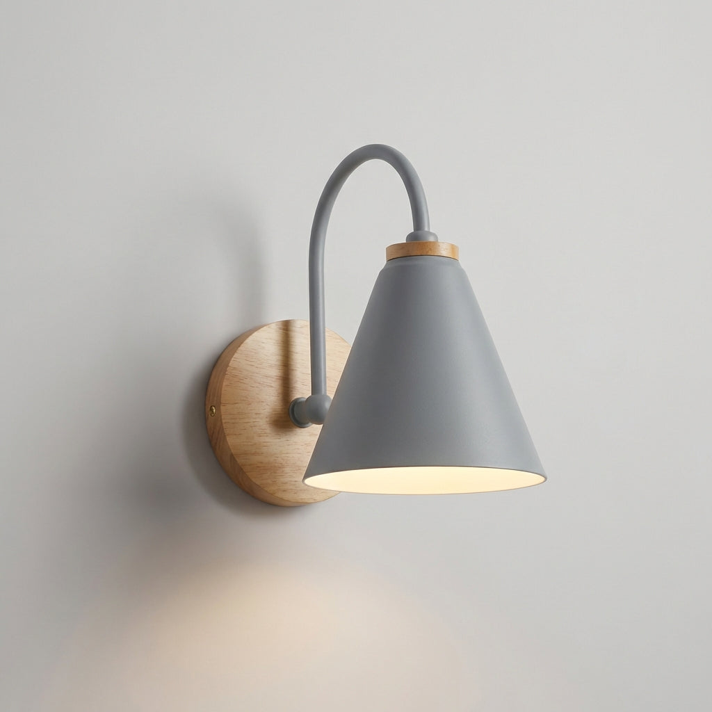 Elegant downward cone shade wall sconce installed in a hallway, offering ambient light and sophisticated home decor.