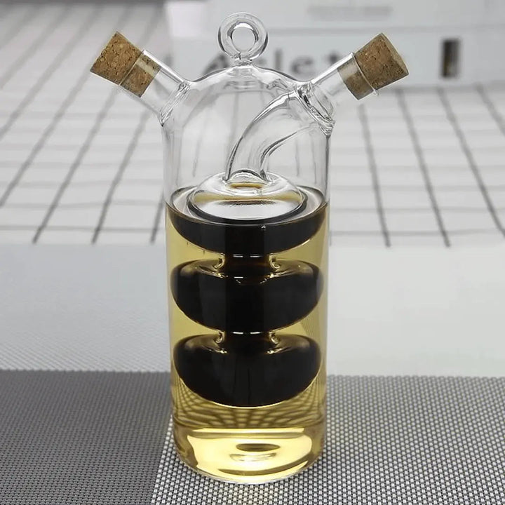 Modern dual glass oil & vinegar dispenser for kitchen, perfect for cooking & seasoning. Space-saving cruet design.
