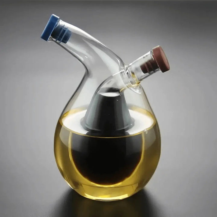 Elegant dual pour oil and vinegar dispenser. Glass cruet for easy kitchen seasoning. Culinary space-saver.