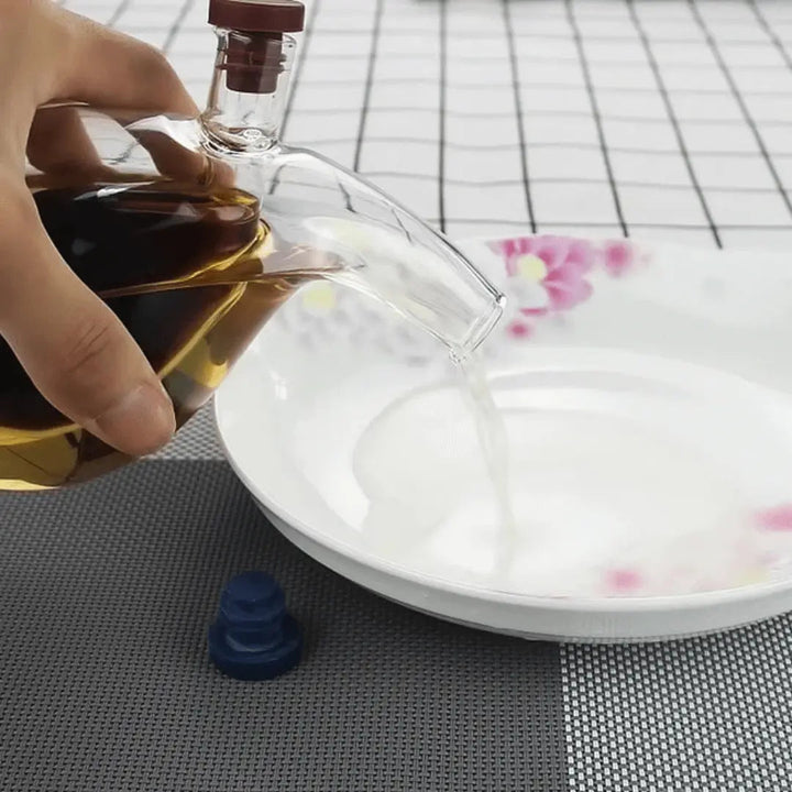 Sleek glass dual oil and vinegar cruet. Ideal kitchen dispenser for cooking oils & vinegars, modern home decor.