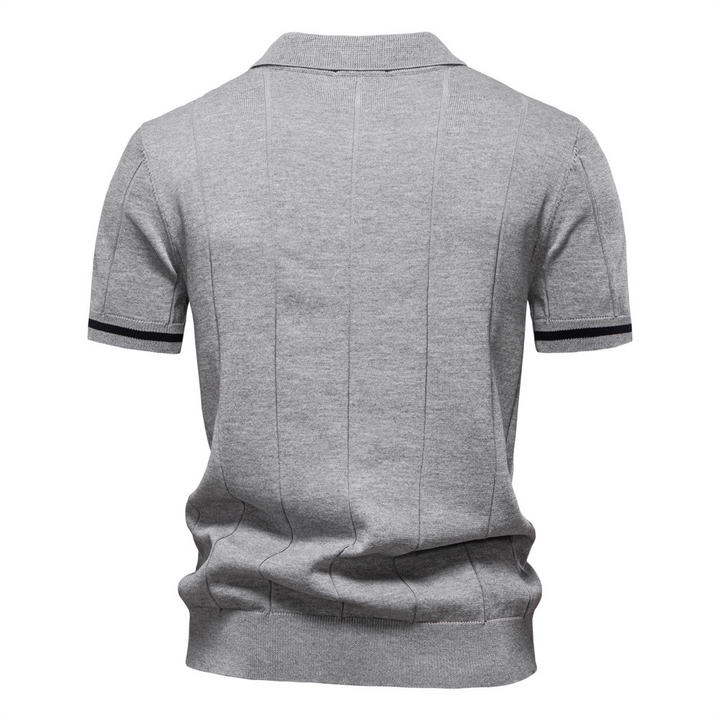 Side profile of a man in a modern fit ribbed polo, emphasizing its comfortable and stylish silhouette.