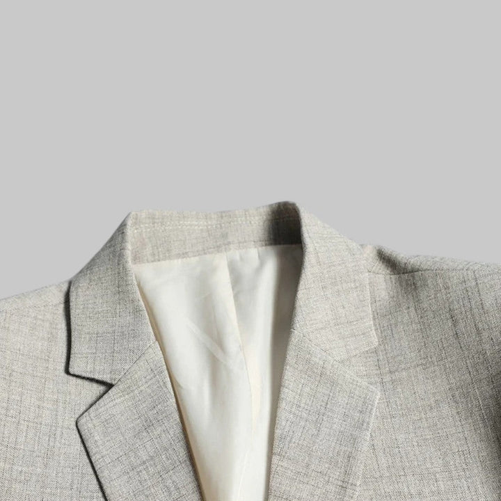 Stylish two-button men's blazer, modern fit for business casual and office menswear.