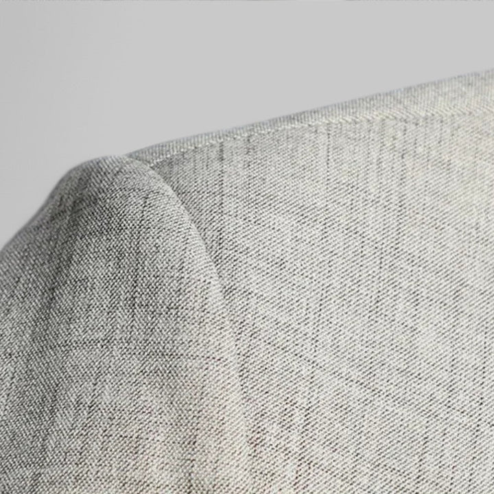 Detail of fabric texture on a modern fit men's two-button business casual blazer.