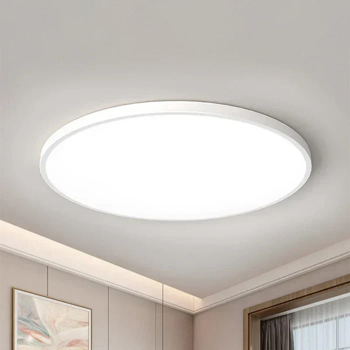 Elegant flat LED ceiling light providing soft aura lighting for a modern dining room or office.