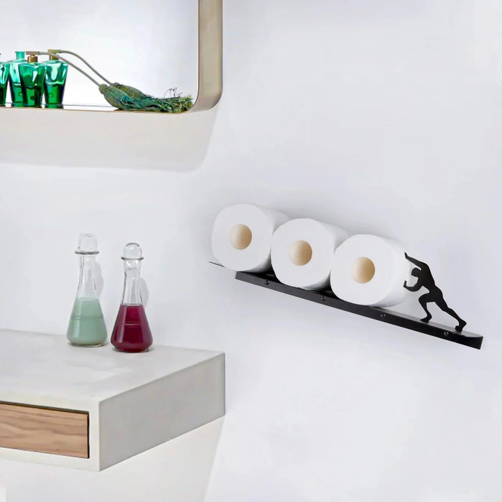 Freestanding toilet roll holder with a sturdy iron frame and a practical top storage shelf for essentials.
