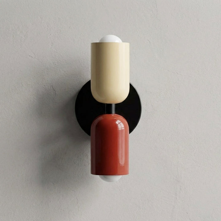 Hardwired geometric wall sconce by Luminore, casting ambient light with its metal & glass design