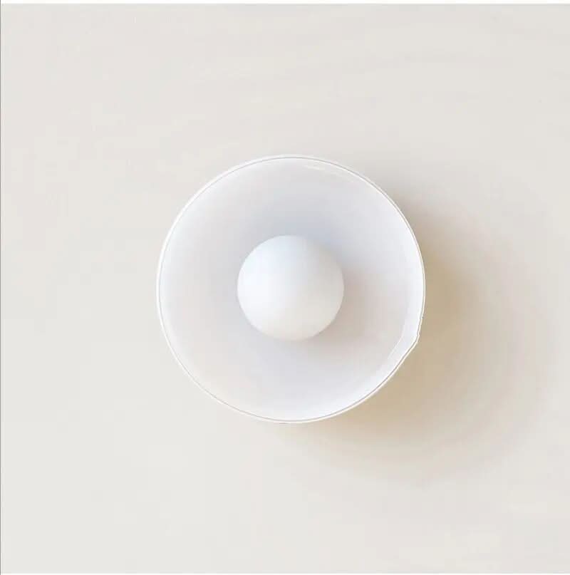 Modern glass fixture for ceilings, a sleek addition to interior design.