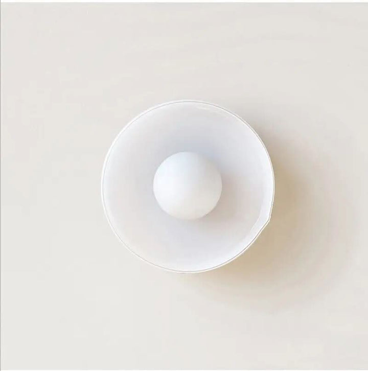 Modern glass fixture for ceilings, a sleek addition to interior design.