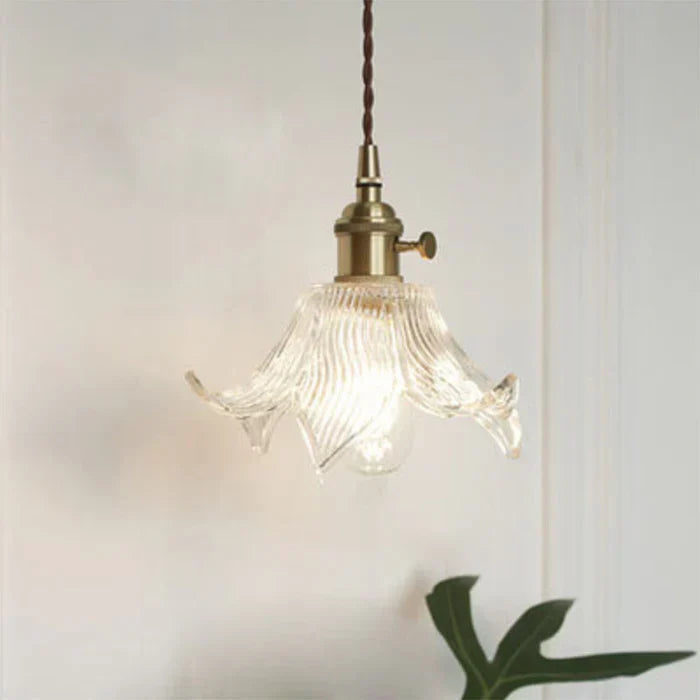 Modern glass pendant lamp for dining room, elegant transparent design, ideal home decor lighting.