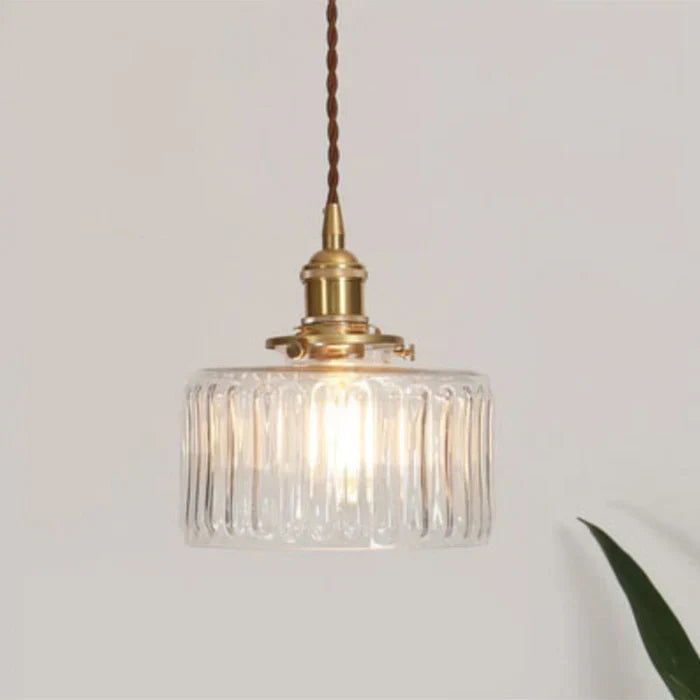 OpulentGlow modern glass pendant lamp, stylish hanging light adding dining room elegance.