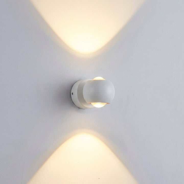 Contemporary LED wall fixture, Glintara model. Adjustable warm light, sleek design for modern home interior lighting.