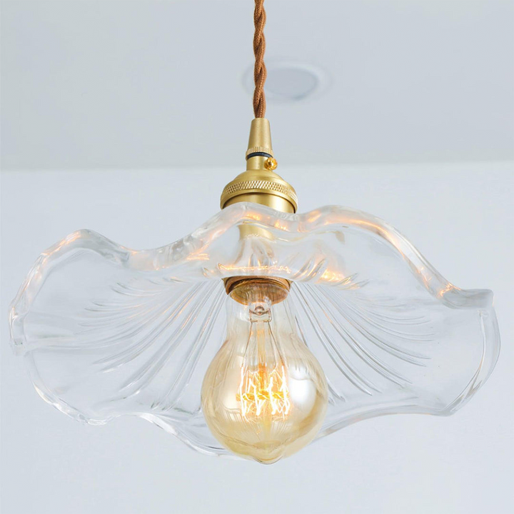 Decorative glass hibiscus flower pendant lamp, a modern ceiling light for ambient home lighting.