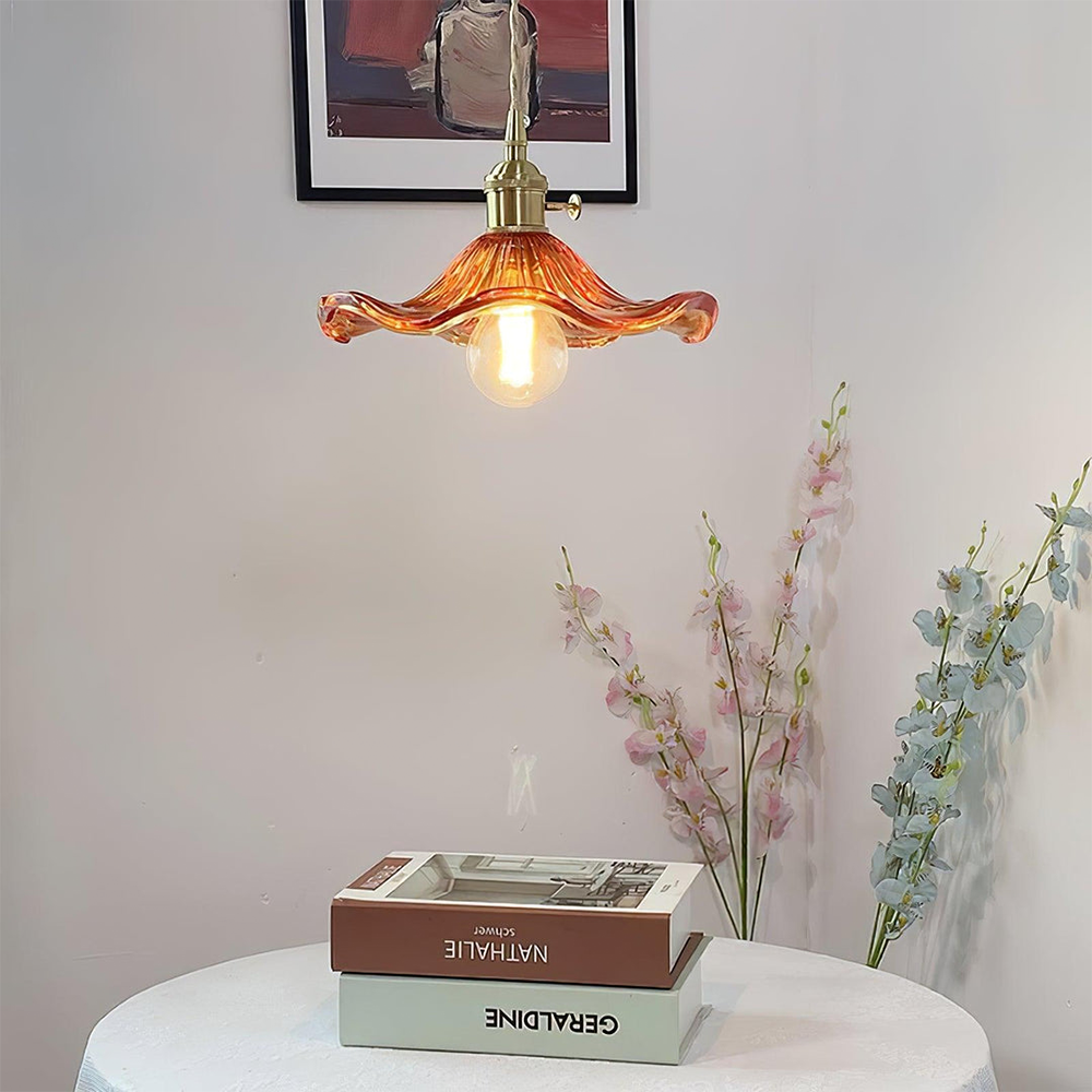 Stylish unisex hibiscus flower light, a modern glass and brass pendant lamp for home.