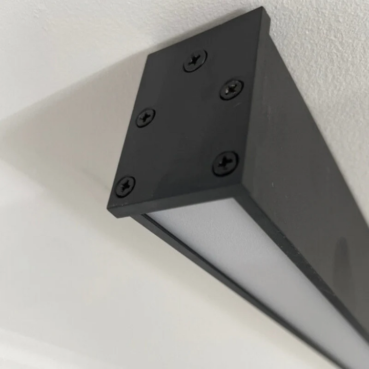 Long linear LED ceiling light, industrial style, energy-efficient and dimmable for modern indoor spaces.
