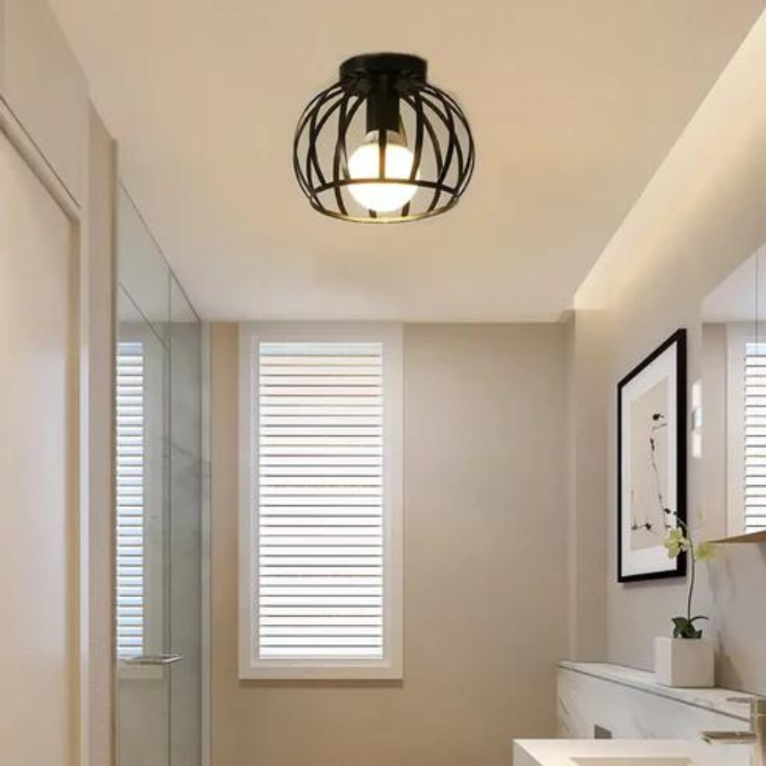 Sleek black metal industrial ceiling light with open cage design. Modern lighting fixture for contemporary homes.