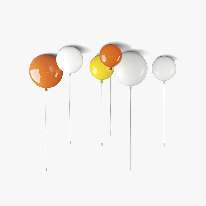 Modern LED balloon ceiling light for kids' bedroom, providing soft, warm illumination.