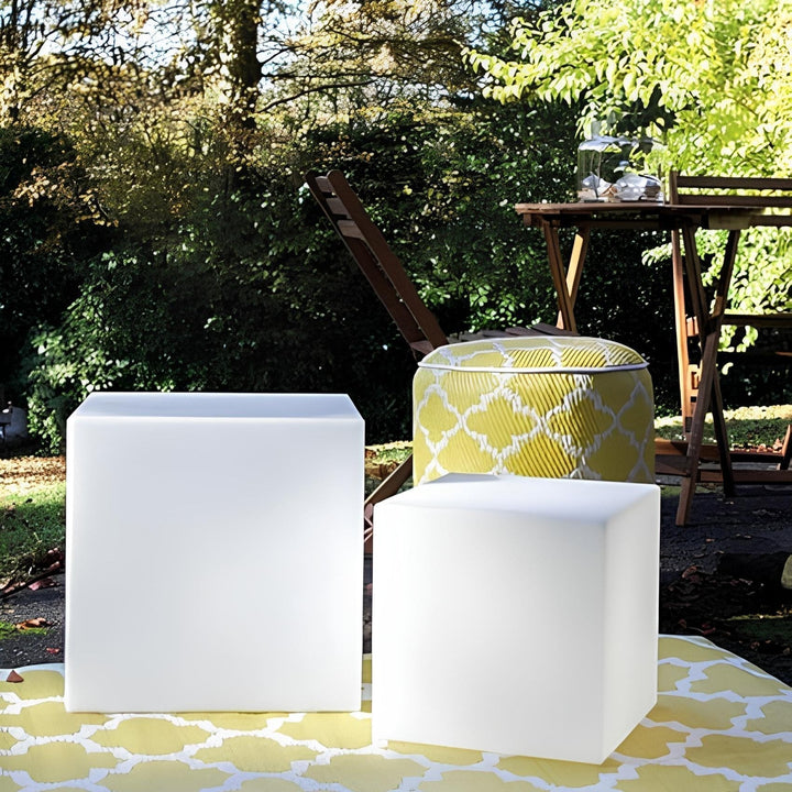 LumaCube LED cube light, mood lighting, alongside a swimming pool