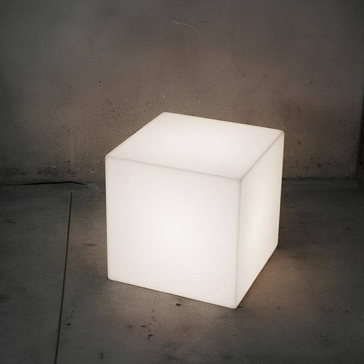 Group of LumaCube LED cube lights, various colors, outdoor setting