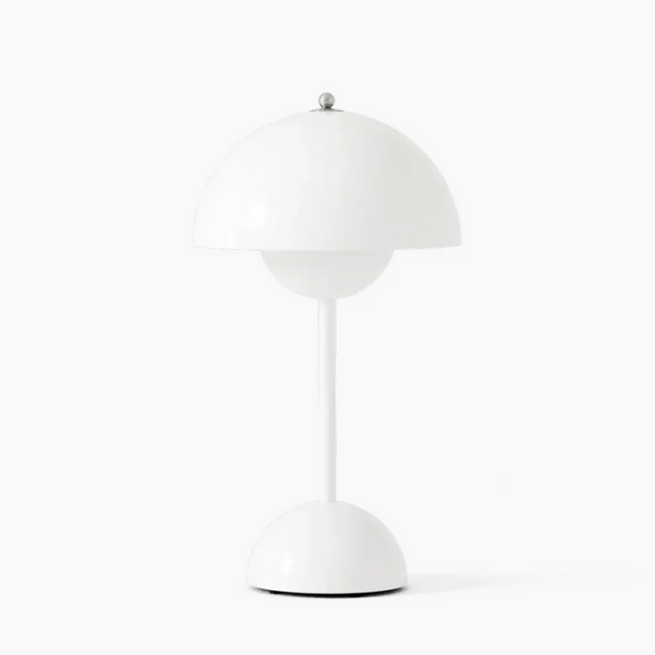 Modern LED desk lamp with touch control, silver finish, illuminating a desk.