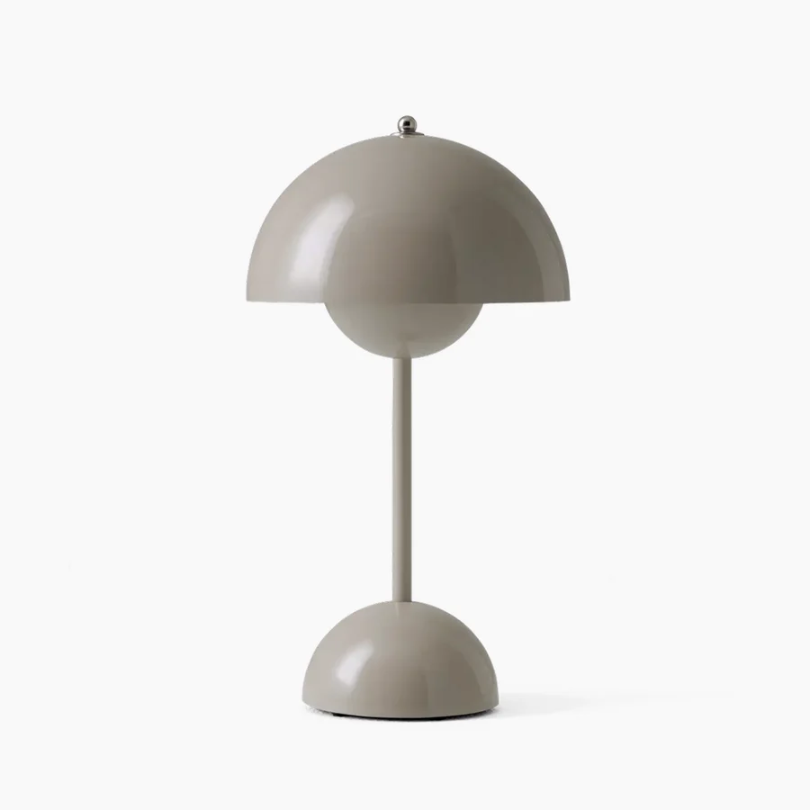 Angled shot of a modern desk lamp, highlighting its flexible arm and LED light.
