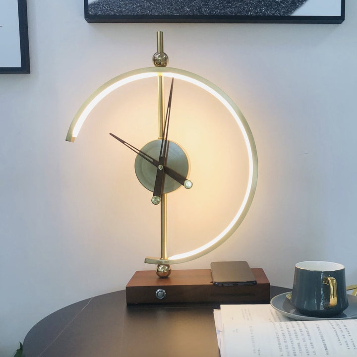 Versatile modern table lamp, rechargeable, adjustable brightness, with Qi wireless charging station.