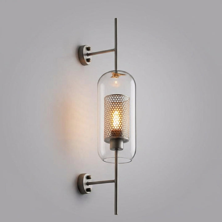Glasierra modern LED wall sconce, featuring clear glass and elegant gold accents for ambient lighting.