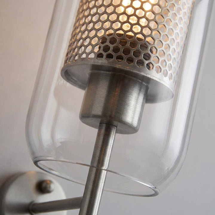 Energy-efficient LED glass wall sconce in a sleek modern design, ideal for interior lighting.